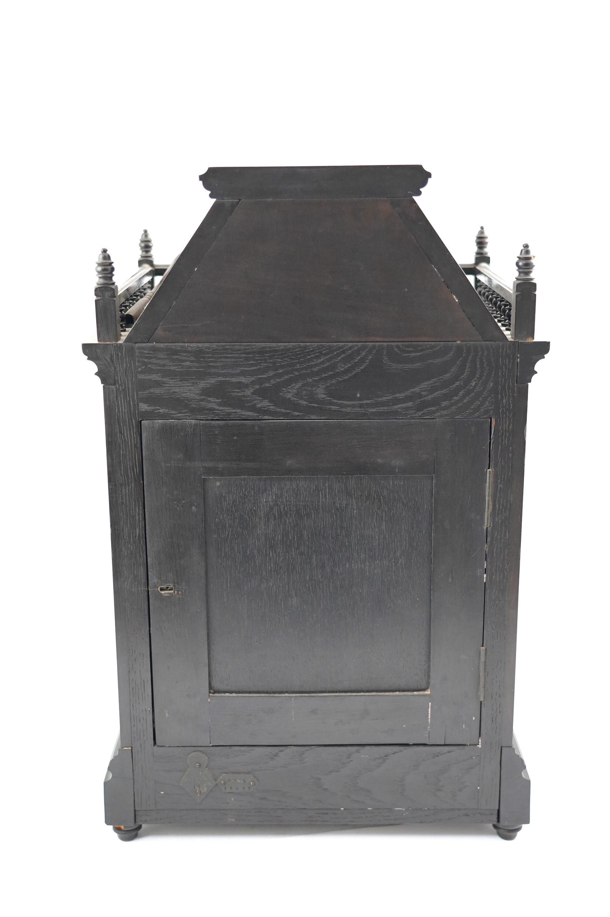 A Victorian Aesthetic Movement ebonised architectural mantel clock, probably designed by Lewis Foreman Day